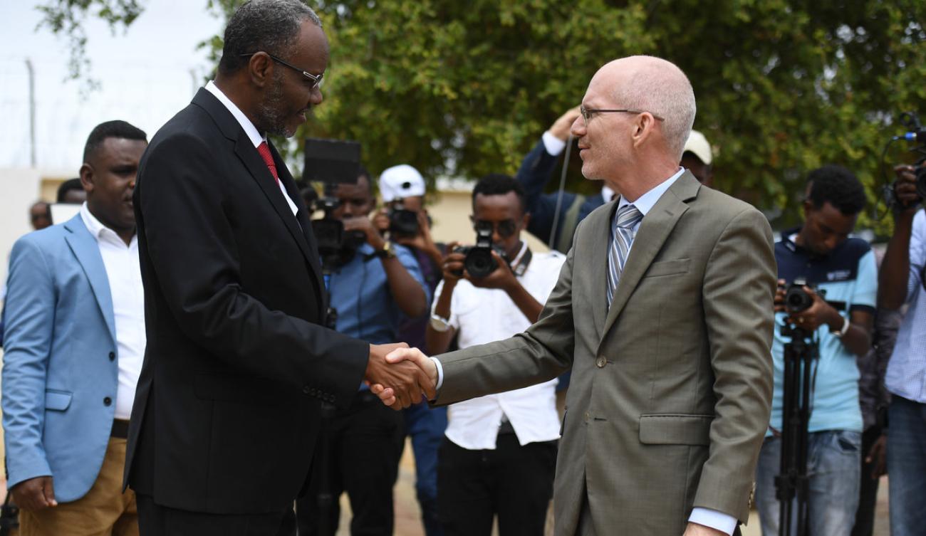 UN Envoy, James  shakes hands with the President of South  West Staes, Abdiaziz Hassan Mohamed 