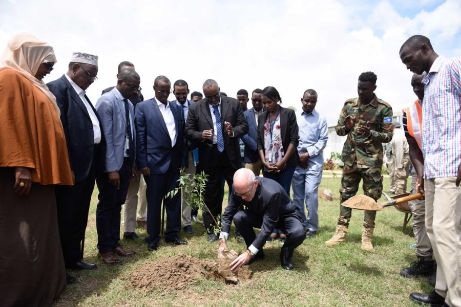 UN Envoy for Somalia, James Swan plans a tree at the UN Compound in Jowhar.