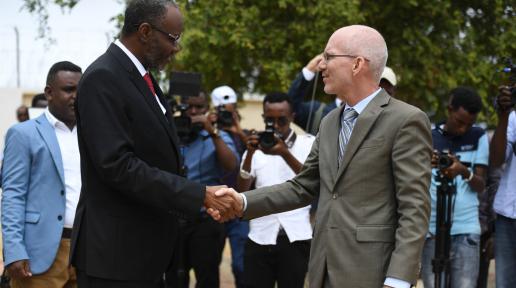 UN Envoy, James  shakes hands with the President of South  West Staes, Abdiaziz Hassan Mohamed 